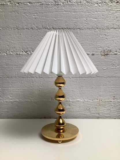 Tanskalainen Hugo Asmussen kullattu pöytävalaisin