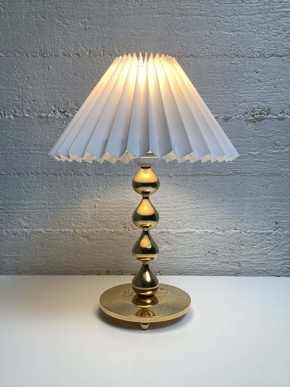 Tanskalainen Hugo Asmussen kullattu pöytävalaisin